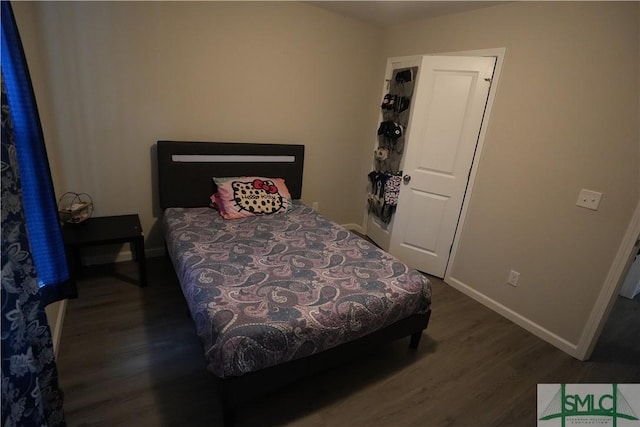 46 Persimmon Dr NE, Ludowici, GA 31316 - bedroom with wood finished floors and baseboards
