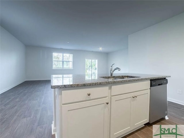 kitchen with dishwasher, a sink, light stone counters, dark wood-style flooring, and white cabinets