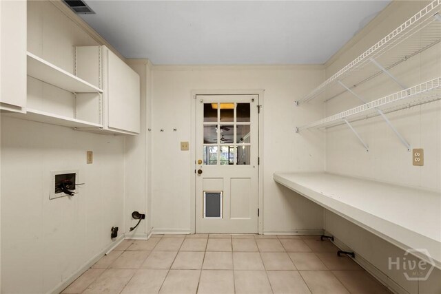 2402 Easy St, Savannah, GA 31406 - clothes washing area featuring baseboards, hookup for a washing machine, and light tile patterned flooring