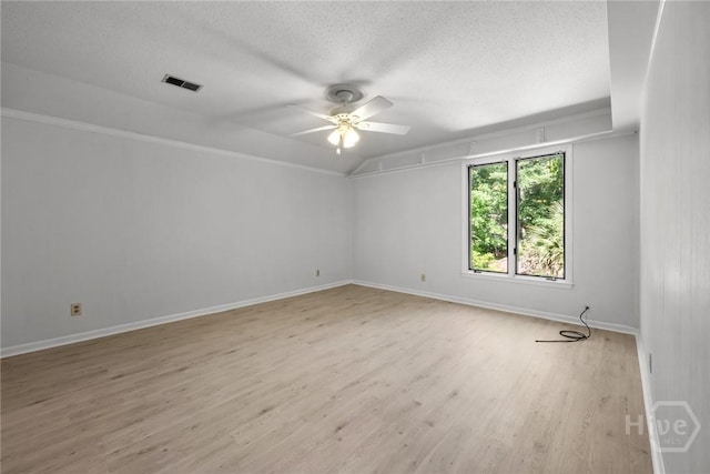 2402 Easy St, Savannah, GA 31406 - empty room with a textured ceiling, ceiling fan, light wood finished floors, and baseboards