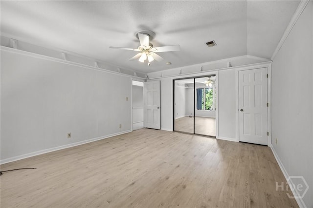 2402 Easy St, Savannah, GA 31406 - unfurnished bedroom with light wood-style flooring, ceiling fan, and baseboards