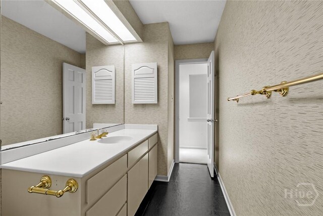 2402 Easy St, Savannah, GA 31406 - bathroom with baseboards and vanity