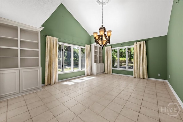 2402 Easy St, Savannah, GA 31406 - tiled empty room featuring a chandelier, high vaulted ceiling, plenty of natural light, and baseboards