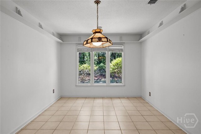 2402 Easy St, Savannah, GA 31406 - spare room featuring a textured ceiling