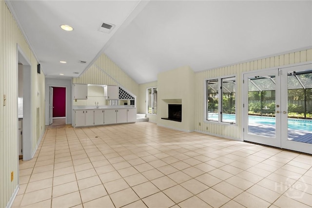 2402 Easy St, Savannah, GA 31406 - unfurnished living room featuring french doors, light tile patterned floors, a sink, and recessed lighting