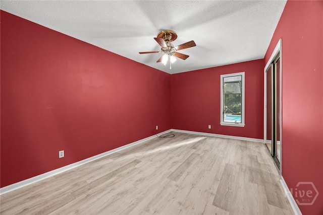2402 Easy St, Savannah, GA 31406 - unfurnished room featuring wood finished floors, ceiling fan, baseboards, and a textured ceiling