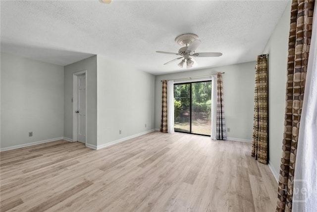 2402 Easy St, Savannah, GA 31406 - unfurnished room with light wood-style floors, a ceiling fan, a textured ceiling, and baseboards