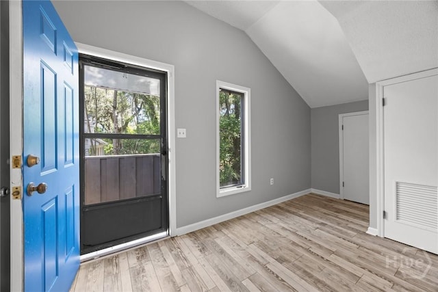 2402 Easy St, Savannah, GA 31406 - foyer with vaulted ceiling, wood finished floors, and baseboards