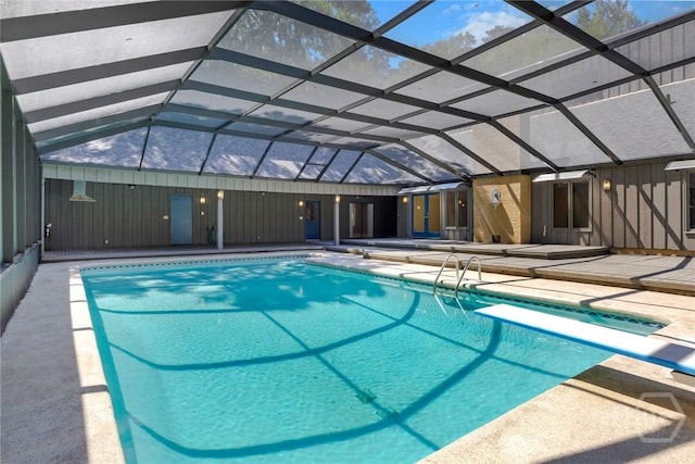 2402 Easy St, Savannah, GA 31406 - swimming pool featuring a patio, a diving board, and a lanai