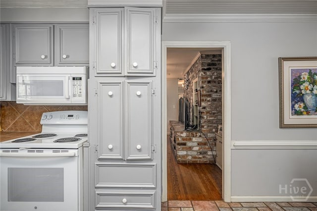 2014 Colonial Dr, Savannah, GA 31406 - kitchen with white appliances, crown molding, and backsplash