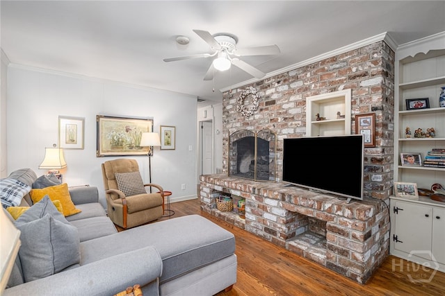 2014 Colonial Dr, Savannah, GA 31406 - living area with a fireplace, ornamental molding, ceiling fan, wood finished floors, and baseboards