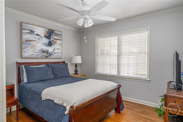 2014 Colonial Dr, Savannah, GA 31406 - bedroom featuring wood finished floors, baseboards, crown molding, and ceiling fan