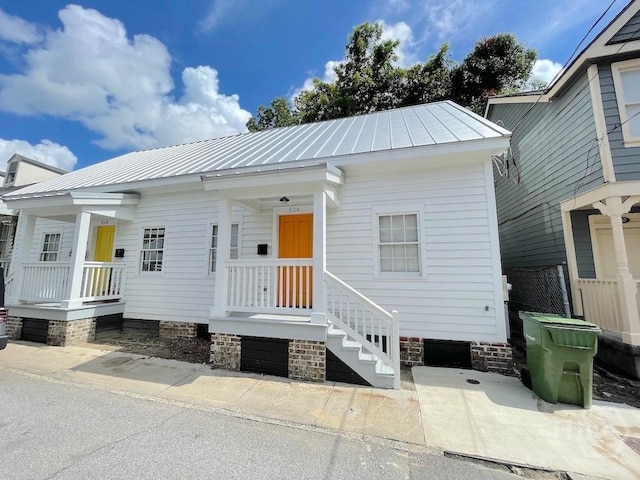 514-516 E Hall St, Savannah, GA 31401 - view of front of house featuring a standing seam roof and metal roof