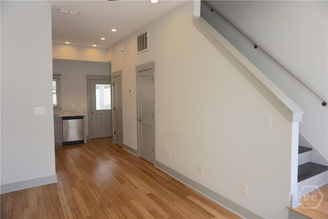 514-516 E Hall St, Savannah, GA 31401 - unfurnished living room with recessed lighting, light wood finished floors, baseboards, and stairs
