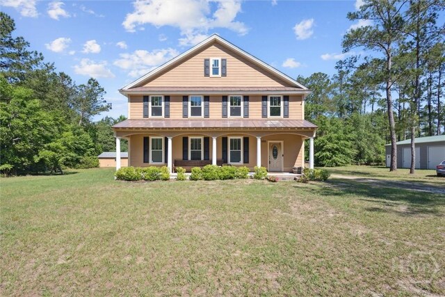 525 Elkins Cemetery Rd, Guyton, GA 31312 - view of front of home with a porch and a front yard