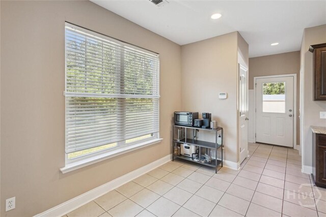 525 Elkins Cemetery Rd, Guyton, GA 31312 - entryway featuring light tile patterned floors, baseboards, and recessed lighting