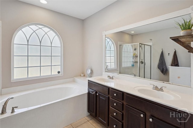 525 Elkins Cemetery Rd, Guyton, GA 31312 - bathroom featuring a garden tub, a stall shower, double vanity, and tile patterned flooring
