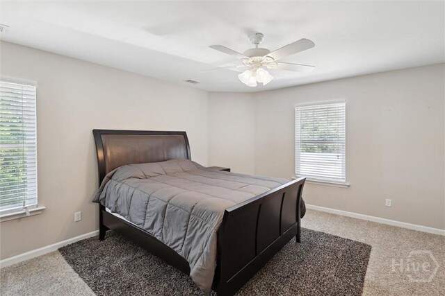 525 Elkins Cemetery Rd, Guyton, GA 31312 - bedroom with light colored carpet, baseboards, and ceiling fan