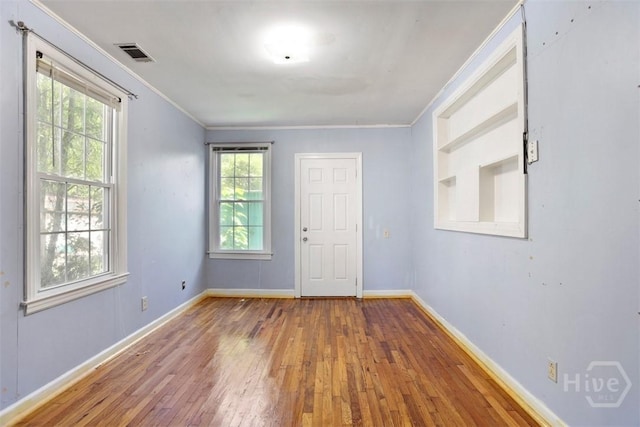 2120 E 39th St, Savannah, GA 31404 - spare room featuring hardwood / wood-style flooring, baseboards, and ornamental molding