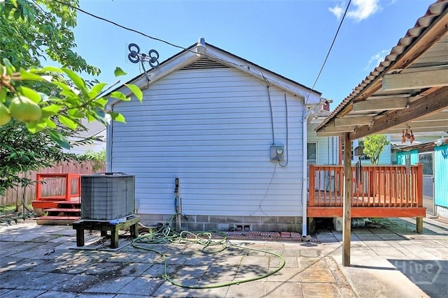 2120 E 39th St, Savannah, GA 31404 - view of side of home featuring a patio, a wooden deck, and central AC unit