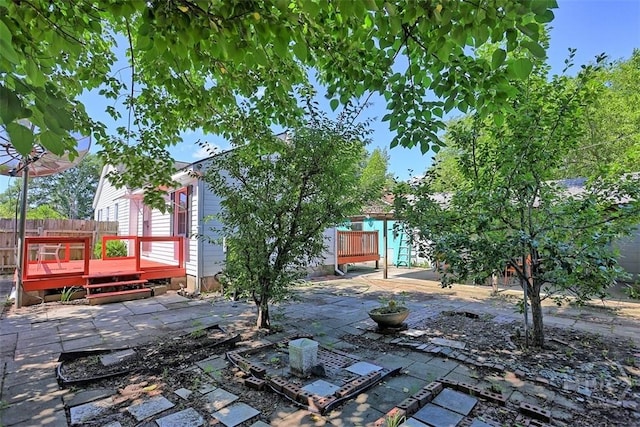 2120 E 39th St, Savannah, GA 31404 - view of yard with a wooden deck, a patio area, and fence