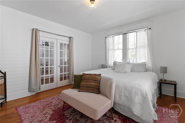 1216 E 31st St, Savannah, GA 31404 - bedroom featuring wood finished floors and french doors