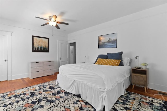 1216 E 31st St, Savannah, GA 31404 - bedroom with wood finished floors, baseboards, and a ceiling fan