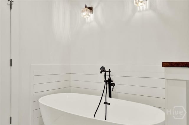 bathroom with a freestanding tub