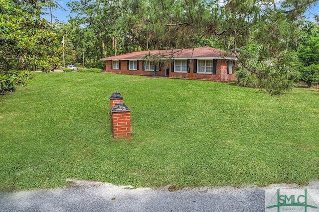 156 Lansing St, Brunswick, GA 31525 - ranch-style house with a front yard and brick siding