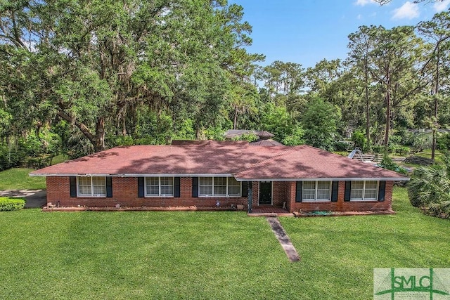 156 Lansing St, Brunswick, GA 31525 - ranch-style house featuring a front lawn and brick siding