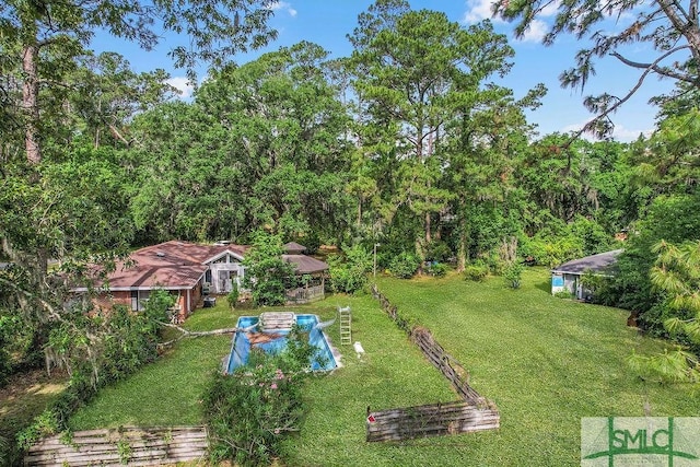 156 Lansing St, Brunswick, GA 31525 - view of grassy yard featuring a wooded view