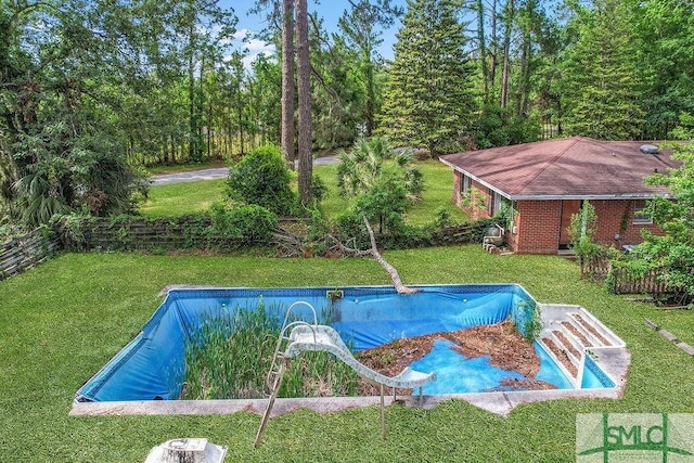 156 Lansing St, Brunswick, GA 31525 - view of pool featuring a lawn, an empty pool, and a water slide
