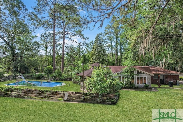 156 Lansing St, Brunswick, GA 31525 - view of grassy yard with an outdoor pool
