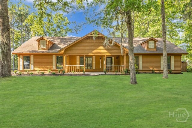 view of front of house with a front lawn and covered porch