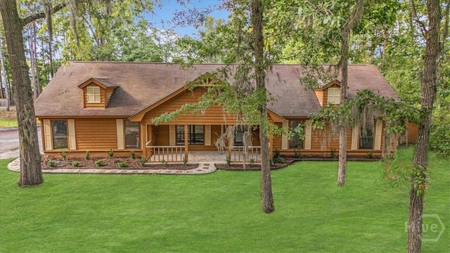 log home featuring a front yard