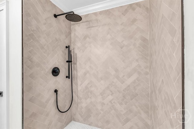 full bathroom with tiled shower and ornamental molding