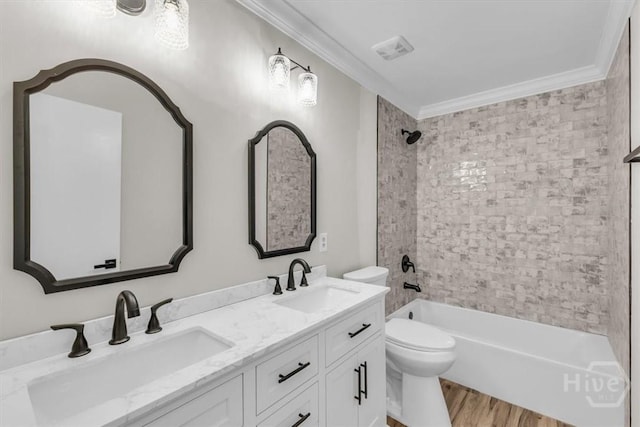 bathroom featuring ornamental molding, toilet, wood finished floors,  shower combination, and double vanity