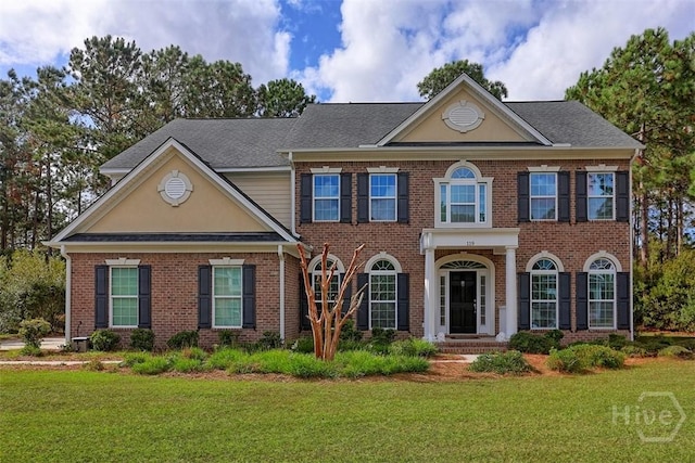119 Sutton Ln, Pooler, GA 31322 - colonial home with brick siding and a front yard