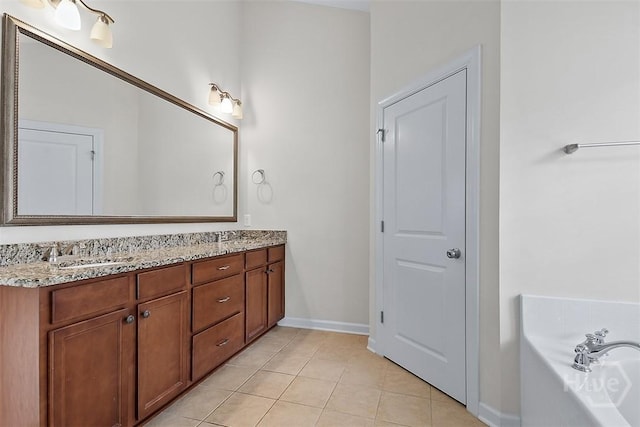 119 Sutton Ln, Pooler, GA 31322 - bathroom with double vanity, tile patterned flooring, a garden tub, and baseboards
