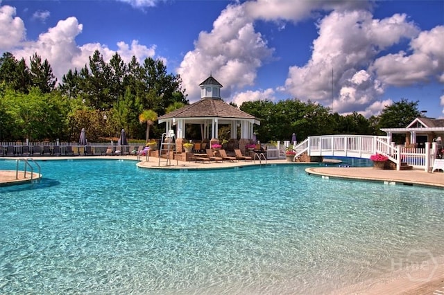 119 Sutton Ln, Pooler, GA 31322 - community pool with a gazebo, fence, a patio area, and view of wooded area