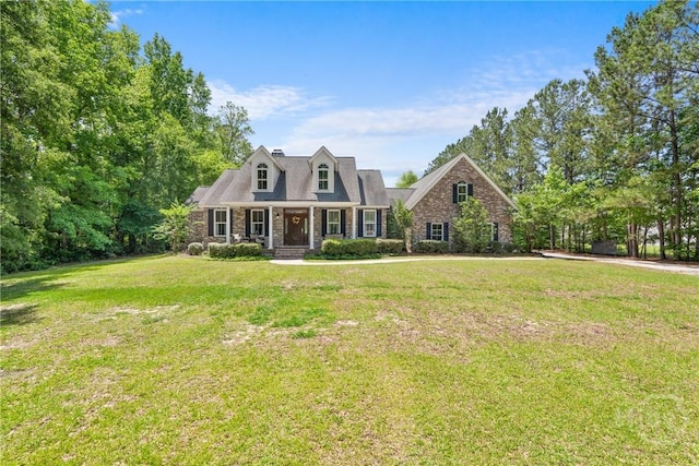 784 Ebenezer Rd, Rincon, GA 31326 - view of front of house featuring covered porch and a front yard