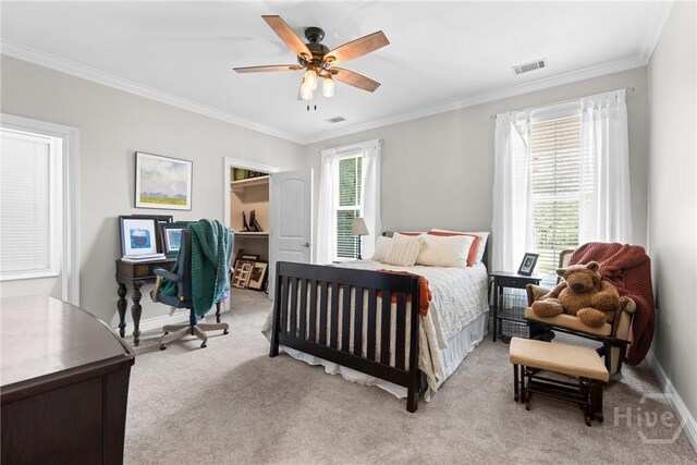 784 Ebenezer Rd, Rincon, GA 31326 - bedroom with ornamental molding, light colored carpet, baseboards, a ceiling fan, and a walk in closet