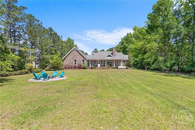 784 Ebenezer Rd, Rincon, GA 31326 - view of green lawn with a fire pit