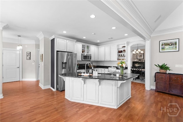 784 Ebenezer Rd, Rincon, GA 31326 - kitchen featuring stainless steel appliances, dark countertops, open shelves, light wood-style flooring, and ornamental molding