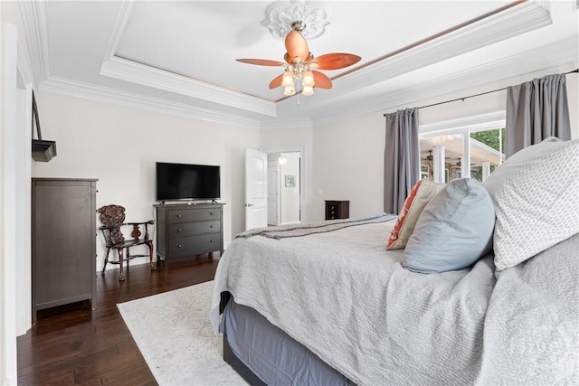784 Ebenezer Rd, Rincon, GA 31326 - bedroom featuring a raised ceiling, ornamental molding, dark wood-type flooring, and ceiling fan
