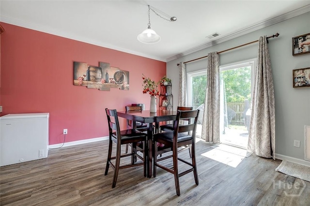 417 Keiffer Dr, Rincon, GA 31326 - dining room with wood finished floors, ornamental molding, and baseboards