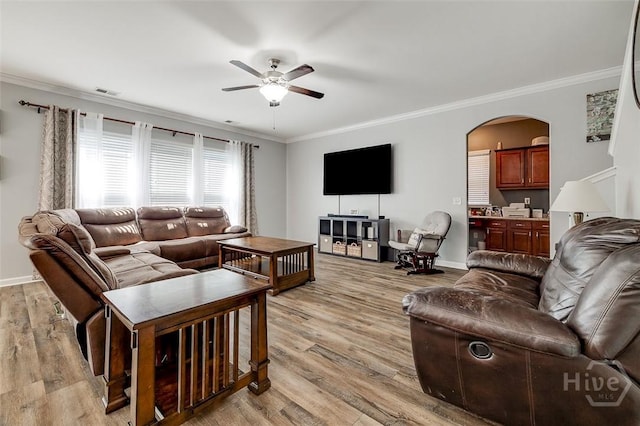 417 Keiffer Dr, Rincon, GA 31326 - living area featuring ceiling fan, arched walkways, crown molding, light wood-type flooring, and baseboards