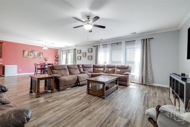 417 Keiffer Dr, Rincon, GA 31326 - living area featuring ceiling fan, crown molding, wood finished floors, and baseboards