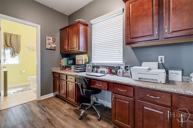 417 Keiffer Dr, Rincon, GA 31326 - office area featuring built in desk, dark wood finished floors, healthy amount of natural light, and baseboards