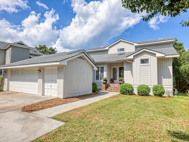3 Riding Ln, Savannah, GA 31411 - view of front of property with an attached garage, a front yard, concrete driveway, and a shingled roof
